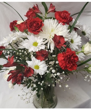 Graduation Bouquet! Miami colors  (G) red and white flowers arranged in a vase.