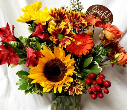 "Gather arrangement"..(F).mixed bright seasonal Fall flowers in a vase with either a Gather piCK!