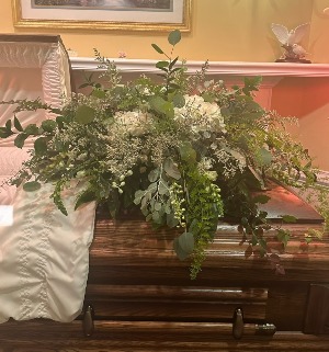 GREENS AND TOUCH OF WHITE FLOWERS Casket Spray