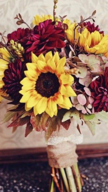  Hand Held Beautiful sunflower, red daisys and khaki sprayed greenery.