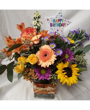 HAPPY BIRTHDAY FLING...fall bright  (F) flowers arranged with seasonal filler and happy birthday pick! FALL FABRIC ON RECTANGLE VASE 