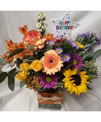 HAPPY BIRTHDAY FLING...fall bright  (F) flowers arranged with seasonal filler and happy birthday pick! FALL FABRIC ON RECTANGLE VASE 