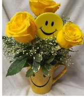HAPPY FACE DELIGHT...happy face mug  (E) with yellow roses and baby's breath or seasonal filler and happy face pic!