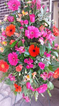 Hot pink and orange standing spray funeral standing spray