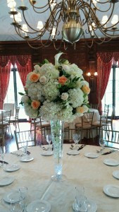 Hydrangea,white and peach roses,calla lilies Tall centerpiece