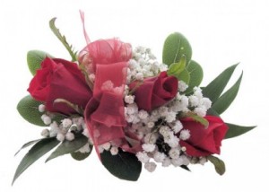 3 red sweetheart roses with baby's breath  (CO) with a wristband and red ribbon or choose your own color ribbon