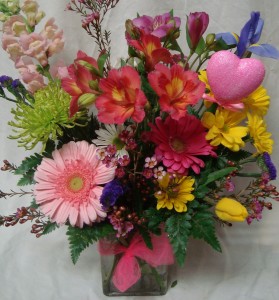 "FROM THE HEART"(VD)...Bright Mixed flowers   Arranged in a vase with heart pick.