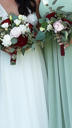 June happiness bride and her attendant bouquet