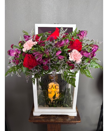 Lantern with fresh flowers  