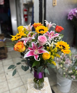 Lillies , sunflowers and roses  