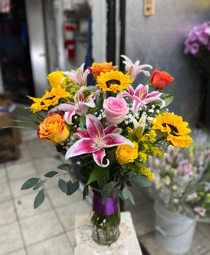 Lillies , sunflowers and roses  