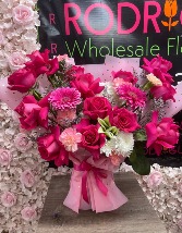 Lively Hot Pink Arrangement Arrangement made of roses, gerber daysies, carnations, cushon, etc.