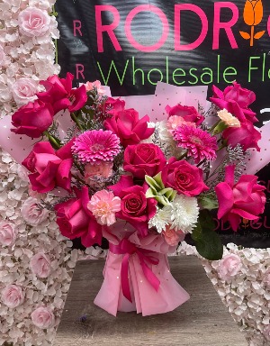 Lively Hot Pink Arrangement Arrangement made of roses, gerber daysies, carnations, cushon, etc.