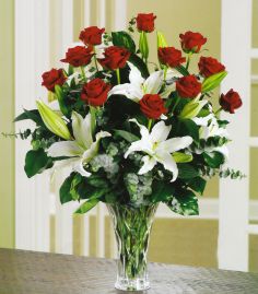 loving lillies 12 long stem roses with white lillies.