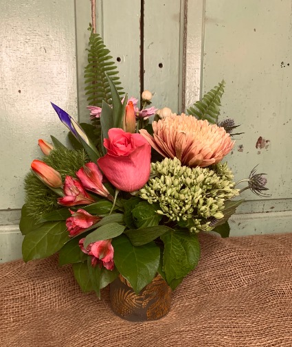 Luxurious Spring  arrangement in a keepsake cylinder candle holder