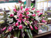 Magnificent casket spray funeral Lilies roses and more