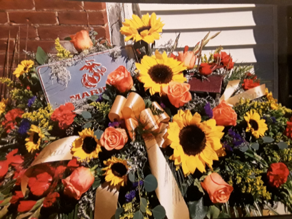 Marines  Fresh with sunflowers, orange roses,  red glass and more