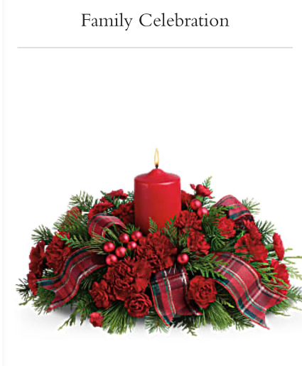 Family celebration Christmas arrangement with mixed Christmas greens and carnations