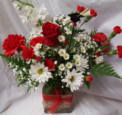 Miami congratulation arrangement  (G)  This Arrangement will have different Reds and white flowers.