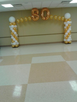 Milestone Birthday Arched with mega numbers for years of celebration.