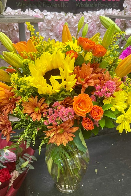 Mixed Fall Arrangement in a vase Sunflowers, mini roses, daysies, lilys, solidago, etc.