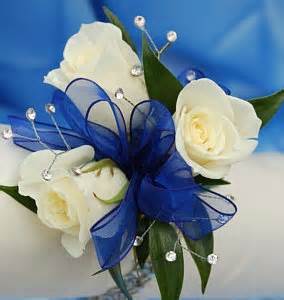 3 white sweetheart roses wrist corsage with (CO)  baby's breath with your choice of ribbon.(More corsages on prom link)