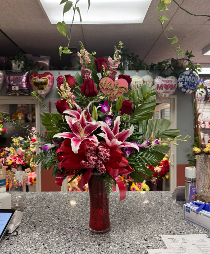 Orchids,lily, and rose arrangement  