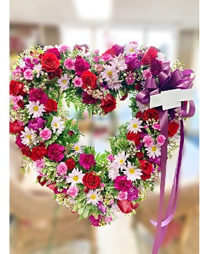 Flowerland Love's Embrace Live Standing Spray heart tribute availible in different colors