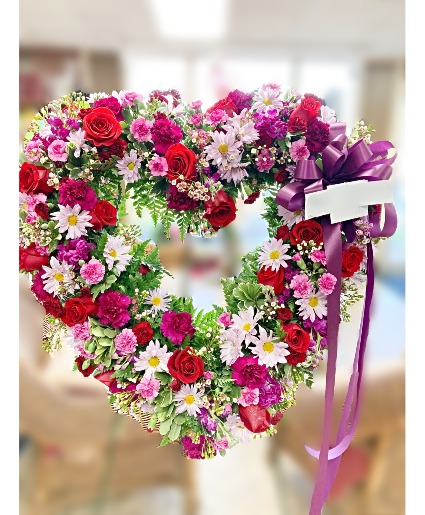 Flowerland Love's Embrace Live Standing Spray heart tribute availible in different colors