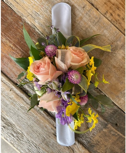 Peach, yellow, purple wildflower corsage