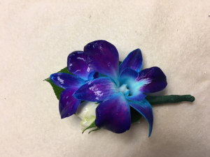 Peaking through the Orchids Boutonniere