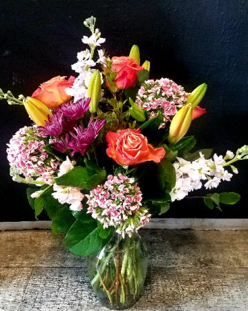 Petals & Vines Orange Roses Vased arrangement 