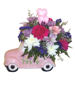 Pink Car load of flowers Variety of fresh cut flowers in a pink car