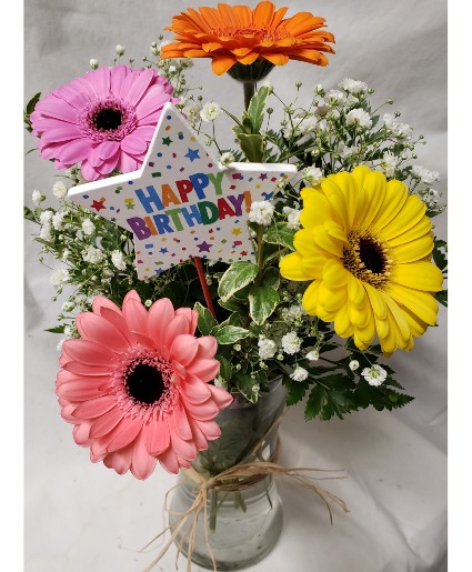 GERBERA BRIGHTS...4 gerbera daisies   (B) with filler In a vase with HAPPY BIRTHDAY PIC INCLUDED(colors may vary with stock)