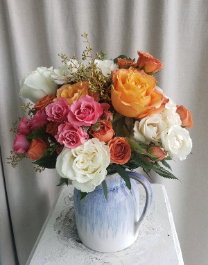 POUR ON THE PRETTY FLOWER ARRANGEMENT