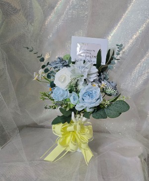 Praying hands faux flower arrangement  Faux flowers