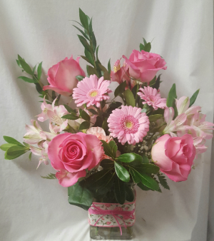 "FULL OF LOVE"...(VD)...ALL FLOWERS ARE SHADES OF Pink. Flowers may vary depending on stock. ARRANGED in a cute ribbon rectangular vase!