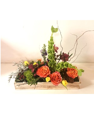 Big box of spring fresh flower in wooden box