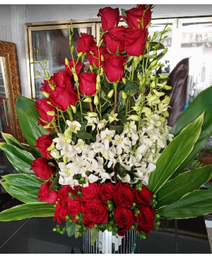 Pure Elegance $399 Lovely Red Roses and Orchid Arrangement