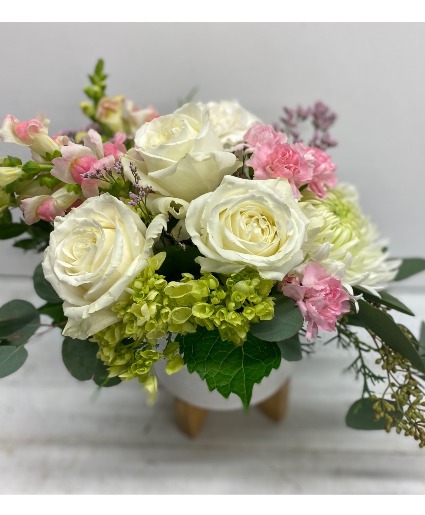 Pure Essence in ceramic container on stand 