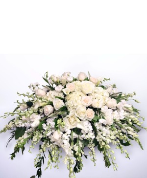 Pure white casket arrangement 