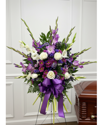 Purple and white funeral arrangement 