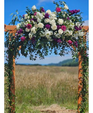 Purple and White Wedding Arbor Ceremony Flowers