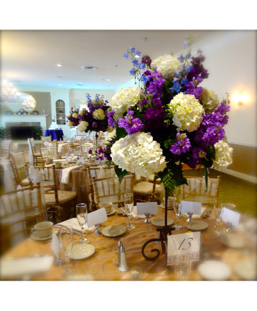 Purple, blue, lavender and white on roth iron guest table centerpieces in Woonsocket, RI | park square florist inc.