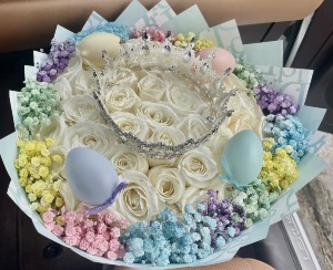 #7 Easter Bouquet 50 white roses bouquet with baby breath around, a crown, and plastic easter eggs