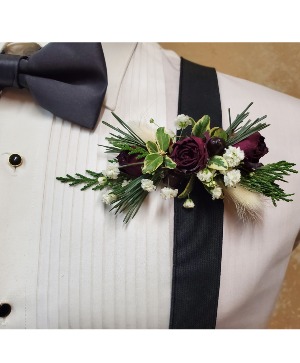 Red floral tie clip boutonnere