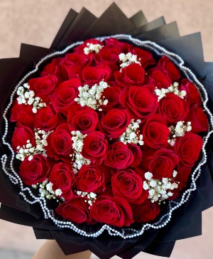 Red Roses with a touch of babies breath  