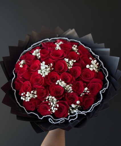 Red Roses with a touch of babies breath  