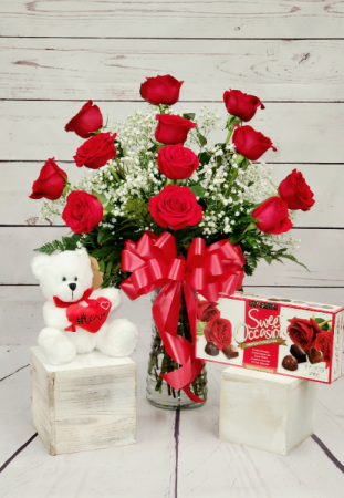 Rosebud Special Dozen red roses arranged in a vase, teddy bear and a box of chocolates in Pawtucket, RI | ROSEBUD FLORIST INC.