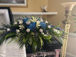 ROYAL BLUE AND WHITE FLOWERS CASKET SPRAY FLOWERS